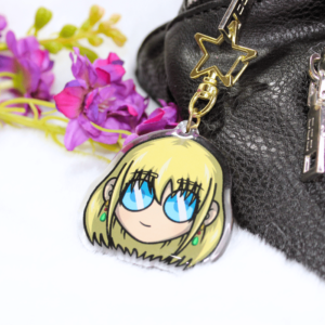 Llavero acrílico con la cara de Howl rubio.
