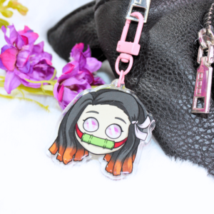 Llavero acrílico con diseño de la cara de Nezuko.