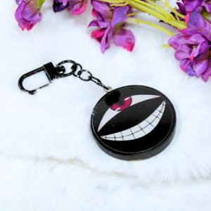 Llavero de resina de color negro con forma circular, inspirado en el Homúnculo Enano del Frasco, del anime FullMetal Alchemist.